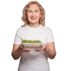 Senior person holding microgreens