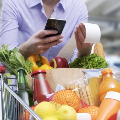 Woman Checking The Grocery Receipt