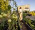 Harvesting in the Garden Near Modern Cabin